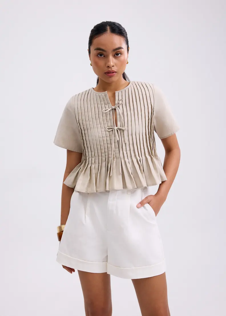 Pintuck Notched Peplum Top